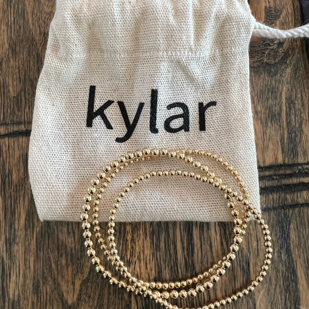 Kylar Mack gold ball bracelets